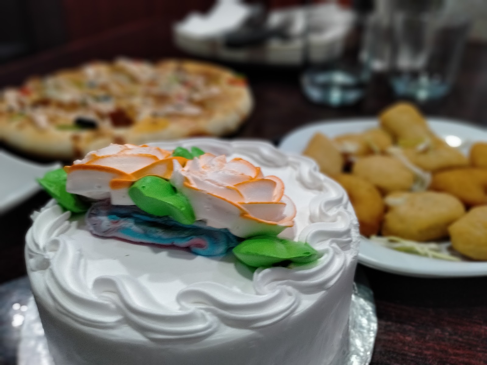 Celebration cake with pizza and nuggets